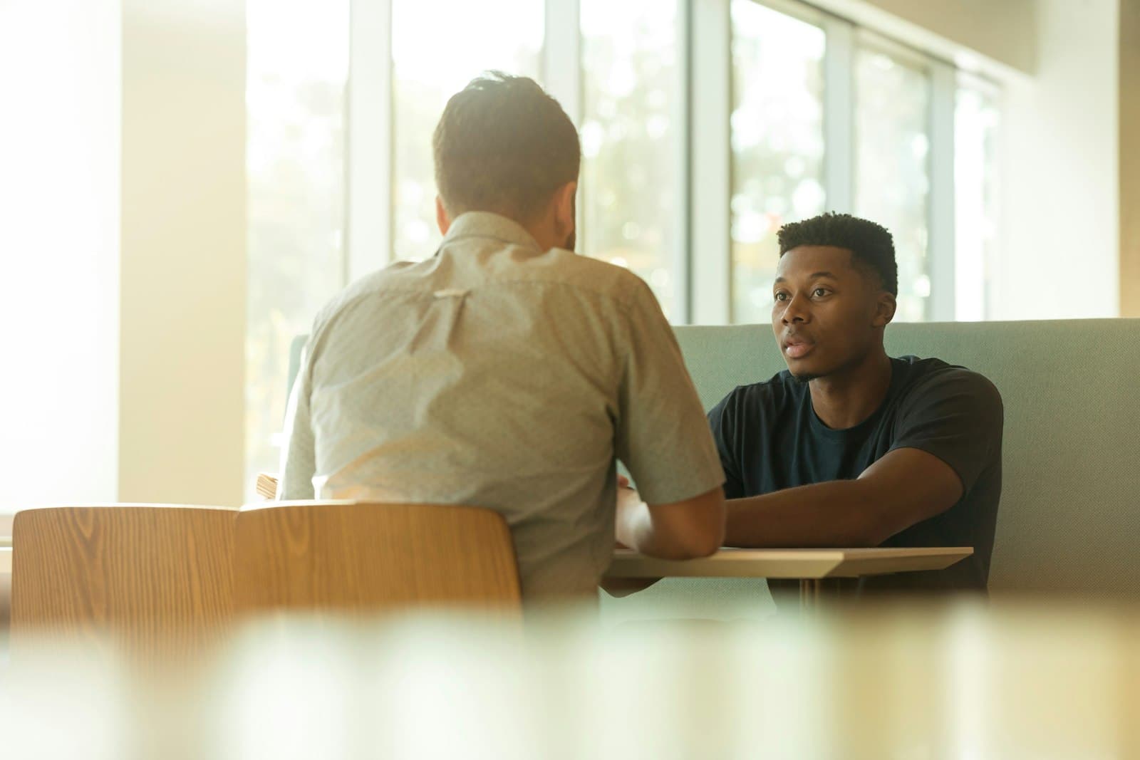 Two people in a friendly consultation